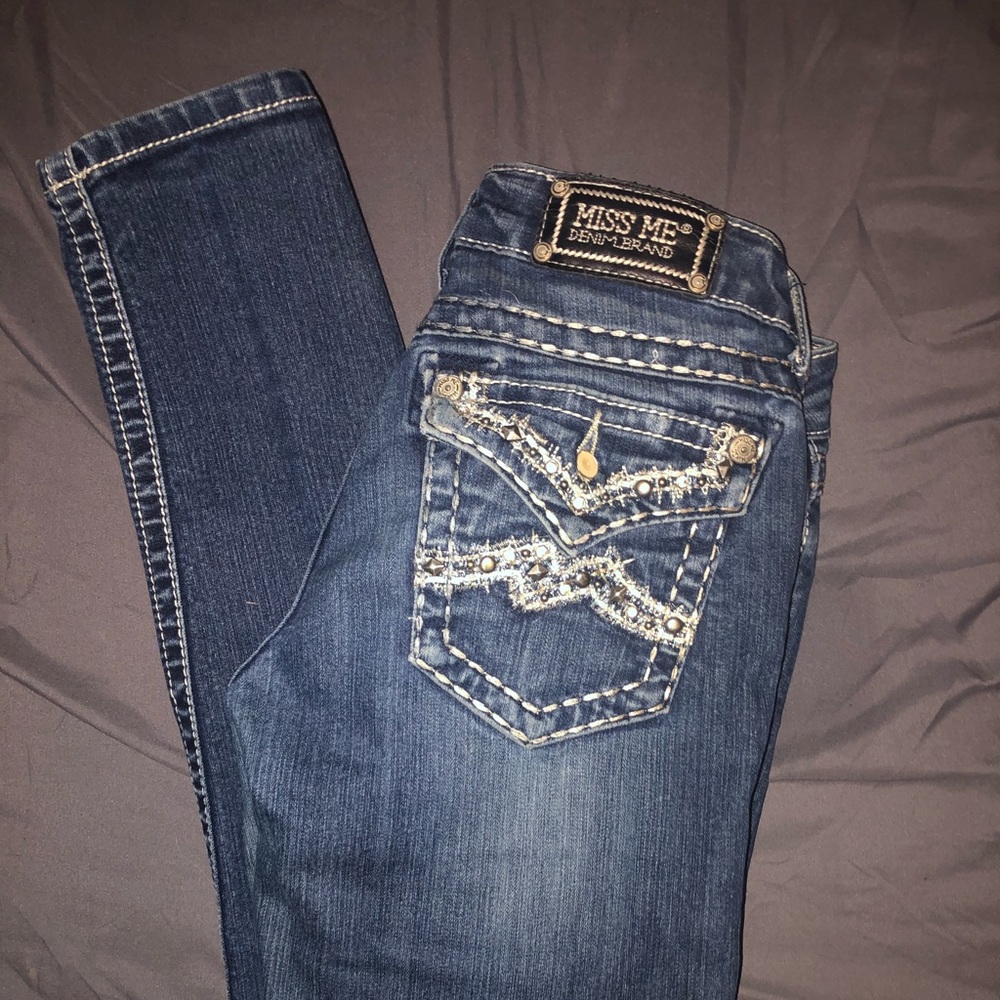 Buckle jeans. Miss Me. Denim brand.